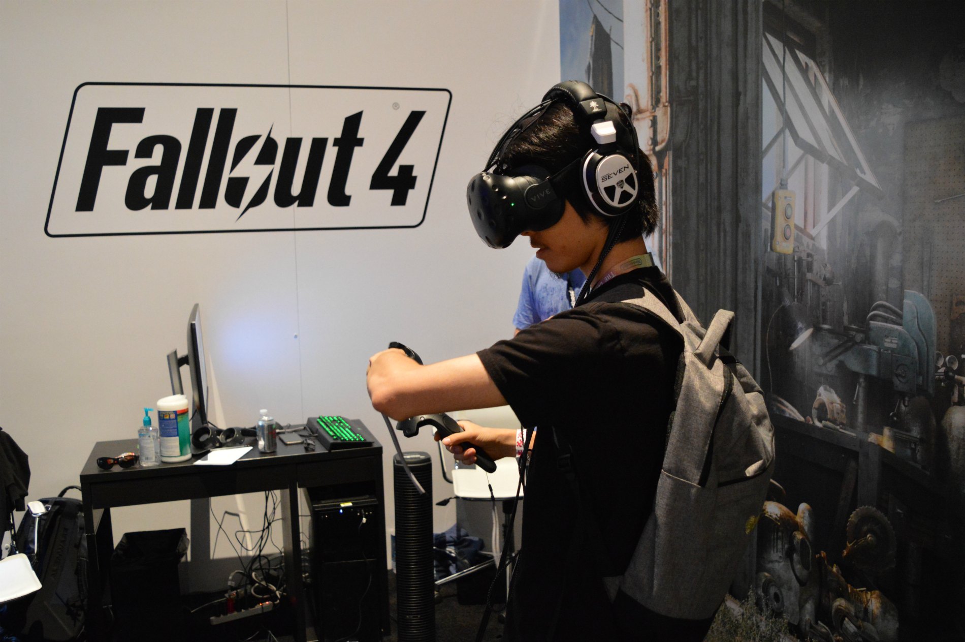 Man demoing Fallout 4 VR with the HTC Vive virtual reality HMD.